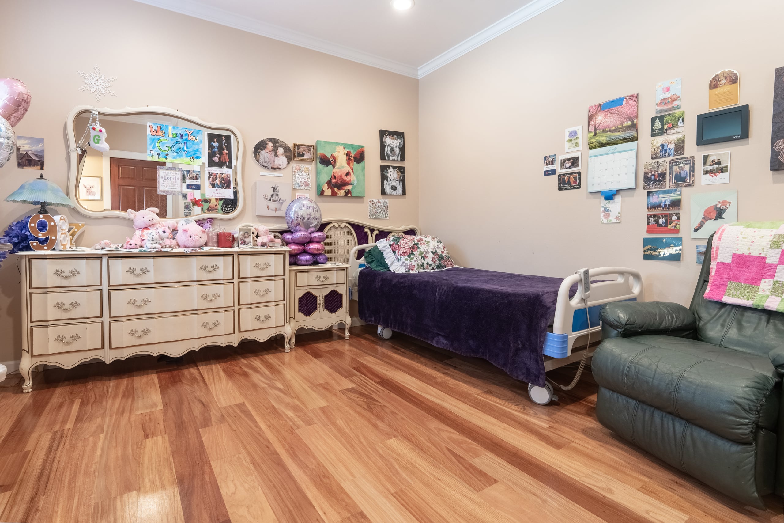 A private bedroom with warm walls, white trim and an adjustable bed.